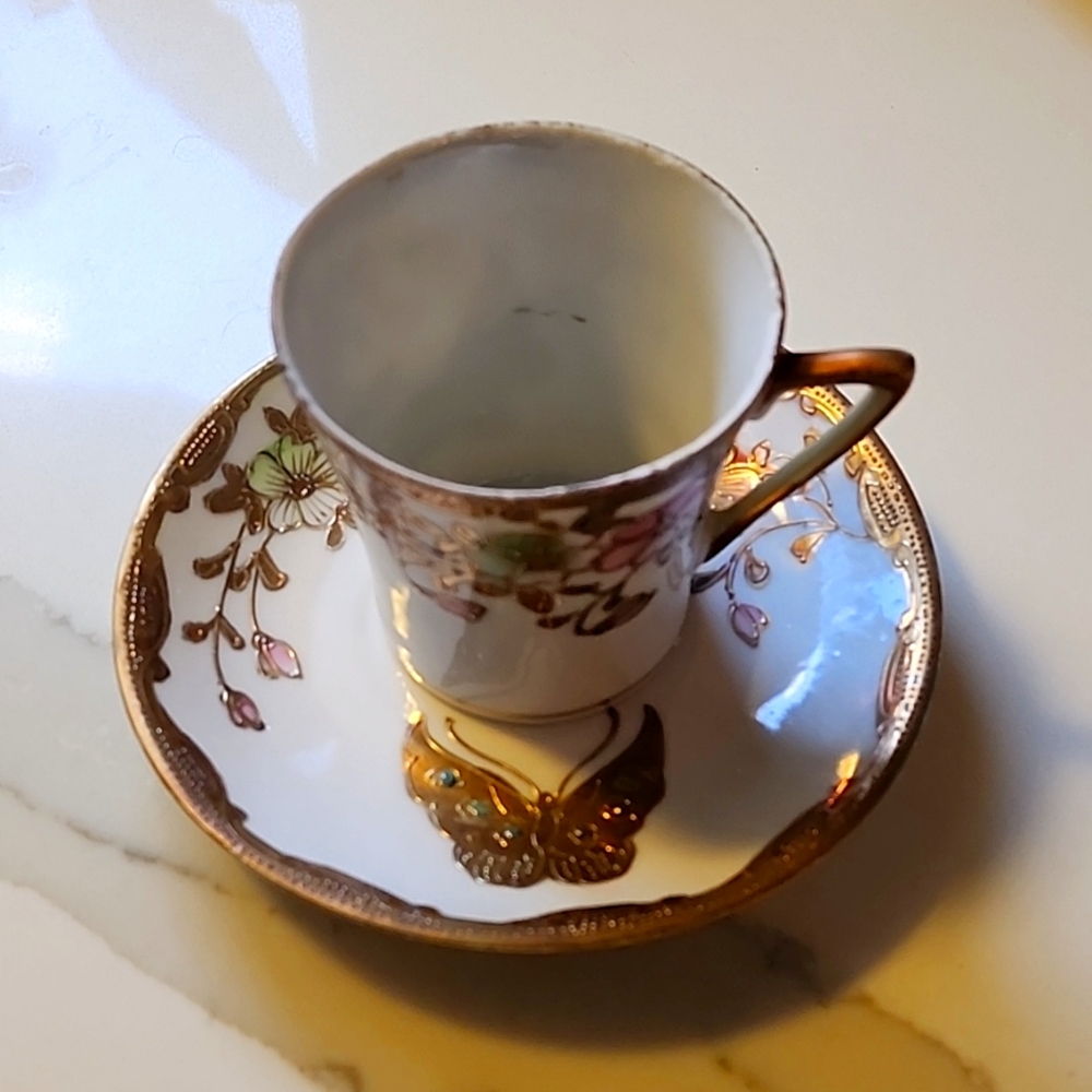 Vintage hand painted tea cup and saucer. From Japan